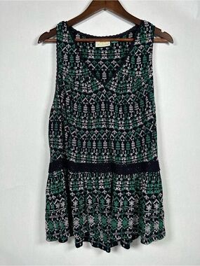 Anthropologie Maeve Cammie embroidered floral peplum top in blue and green.